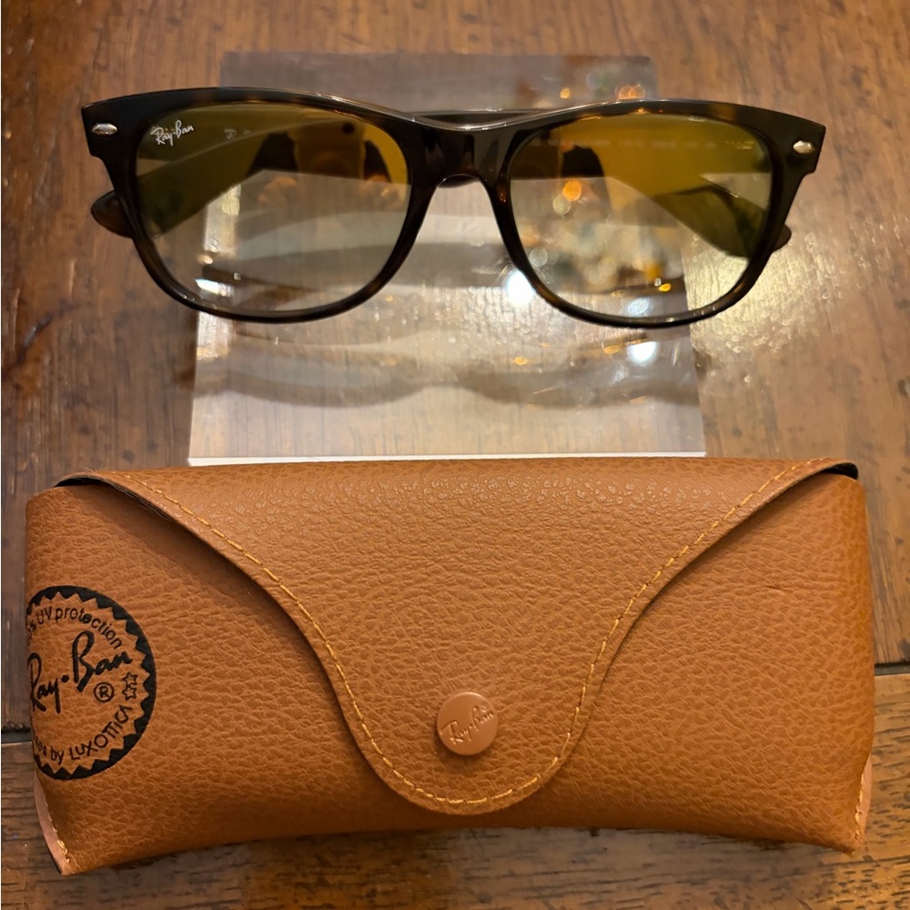 Ray-Ban New Wayfarer Tortoise with Blue Gradient lenses.
